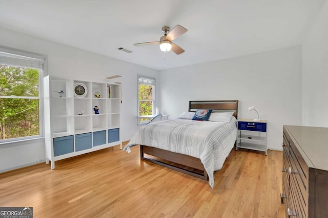 1025 Saint Marks Walk, Suwanee, GA 30024 - bedroom featuring light wood finished floors, a ceiling fan, and baseboards