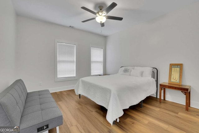 1025 Saint Marks Walk, Suwanee, GA 30024 - bedroom with light wood-type flooring, baseboards, and ceiling fan