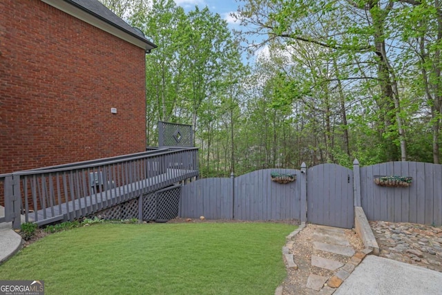 1025 Saint Marks Walk, Suwanee, GA 30024 - view of yard with a gate and a wooden deck