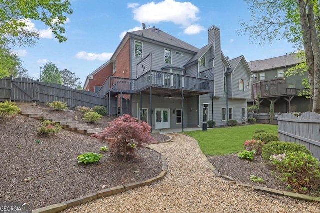 1025 Saint Marks Walk, Suwanee, GA 30024 - rear view of property with a deck, a chimney, and a gate