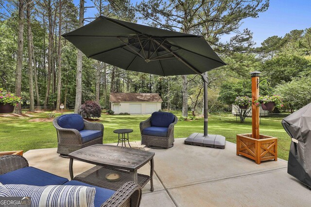 view of patio / terrace with an outbuilding