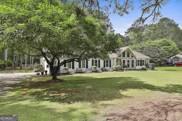 view of front of house with a front yard and driveway