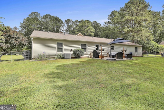 back of property with cooling unit and a patio