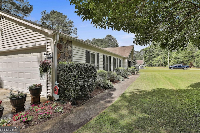 view of property exterior with a lawn, stone siding, and an attached garage