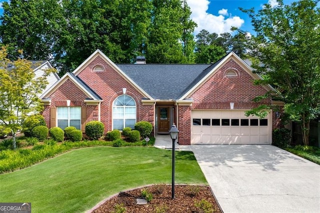 view of front of home with a garage, driveway, brick siding, a front lawn, and a chimney