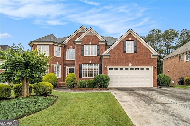 4045 Bonnett Creek Ln, Hoschton, GA 30548 - view of front facade featuring brick siding, a garage, driveway, and a front lawn