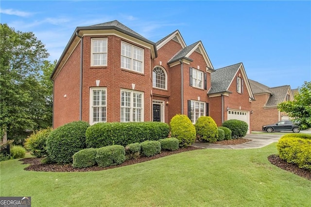 4045 Bonnett Creek Ln, Hoschton, GA 30548 - view of front of home featuring brick siding, a front yard, and a garage