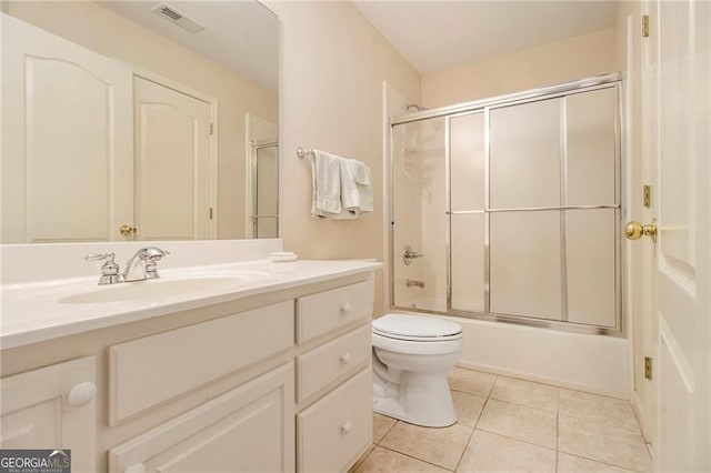 4045 Bonnett Creek Ln, Hoschton, GA 30548 - full bath with toilet, vanity, tile patterned floors, and shower / bath combination with glass door