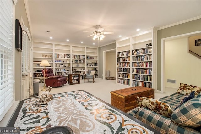 4045 Bonnett Creek Ln, Hoschton, GA 30548 - living area with crown molding, carpet floors, a ceiling fan, recessed lighting, and built in features