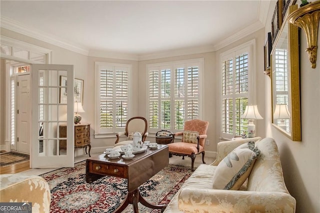 4045 Bonnett Creek Ln, Hoschton, GA 30548 - living area with healthy amount of natural light, baseboards, ornamental molding, and wood finished floors