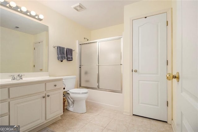 4045 Bonnett Creek Ln, Hoschton, GA 30548 - bathroom with vanity, toilet, bath / shower combo with glass door, and tile patterned floors