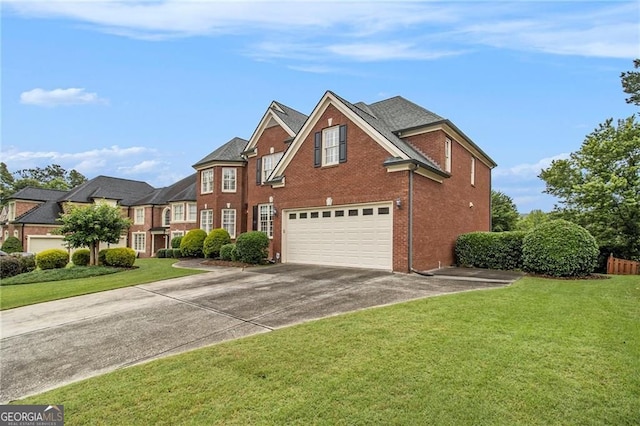 4045 Bonnett Creek Ln, Hoschton, GA 30548 - view of front of home featuring concrete driveway, a garage, brick siding, and a front lawn
