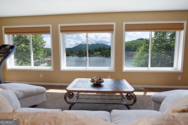 327 Chatuge Village Cir, Hayesville, NC 28904 - carpeted living room featuring baseboards and healthy amount of natural light