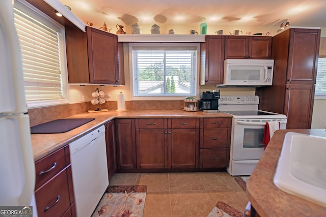 327 Chatuge Village Cir, Hayesville, NC 28904 - kitchen with white appliances, a sink, light countertops, and light tile patterned floors