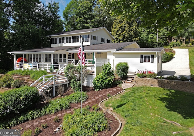 327 Chatuge Village Cir, Hayesville, NC 28904 - view of front of house with a front lawn, stairway, and a porch