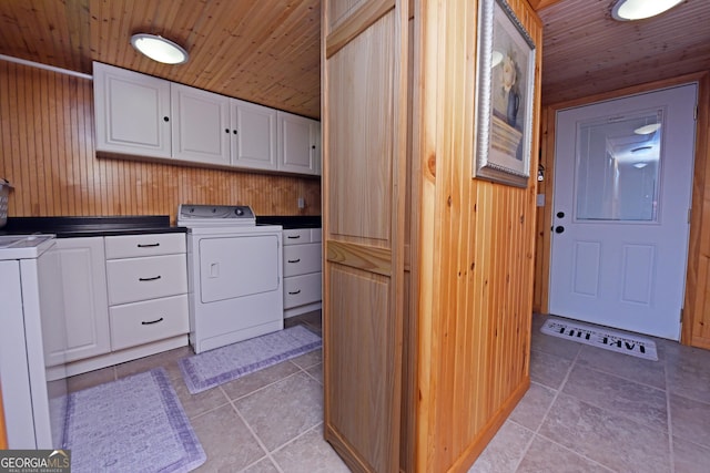 327 Chatuge Village Cir, Hayesville, NC 28904 - clothes washing area with cabinet space, wooden ceiling, wooden walls, light tile patterned floors, and washing machine and dryer