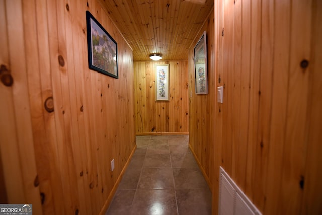 327 Chatuge Village Cir, Hayesville, NC 28904 - hallway featuring wooden ceiling, wood walls, baseboards, and tile patterned flooring