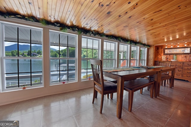327 Chatuge Village Cir, Hayesville, NC 28904 - dining area featuring tile patterned flooring, healthy amount of natural light, wood ceiling, and a water and mountain view