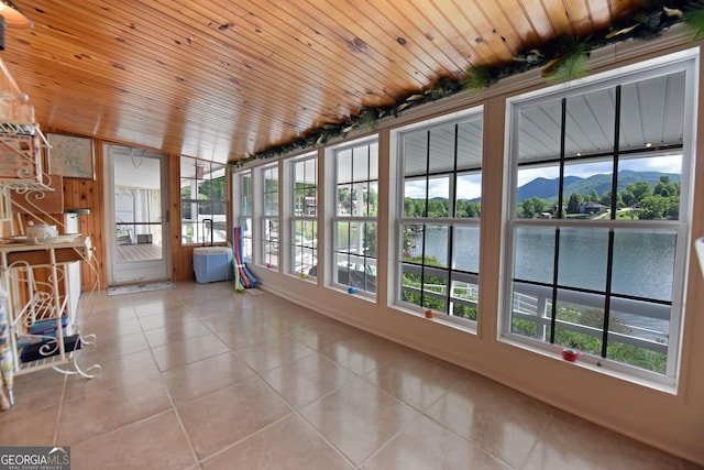 327 Chatuge Village Cir, Hayesville, NC 28904 - unfurnished sunroom with plenty of natural light, tile patterned floors, and a water view