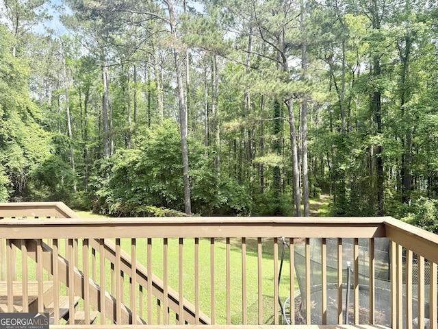 deck featuring a lawn