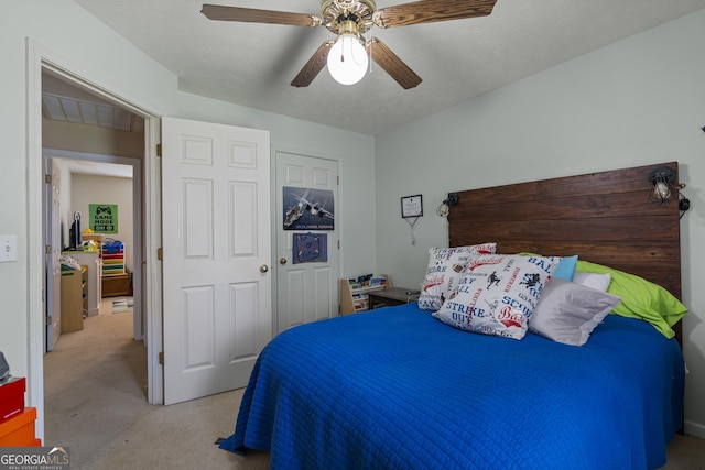 carpeted bedroom with ceiling fan