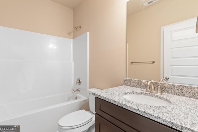 123 Oak Rd, Locust Grove, GA 30248 - bathroom featuring toilet, vanity, and shower / washtub combination