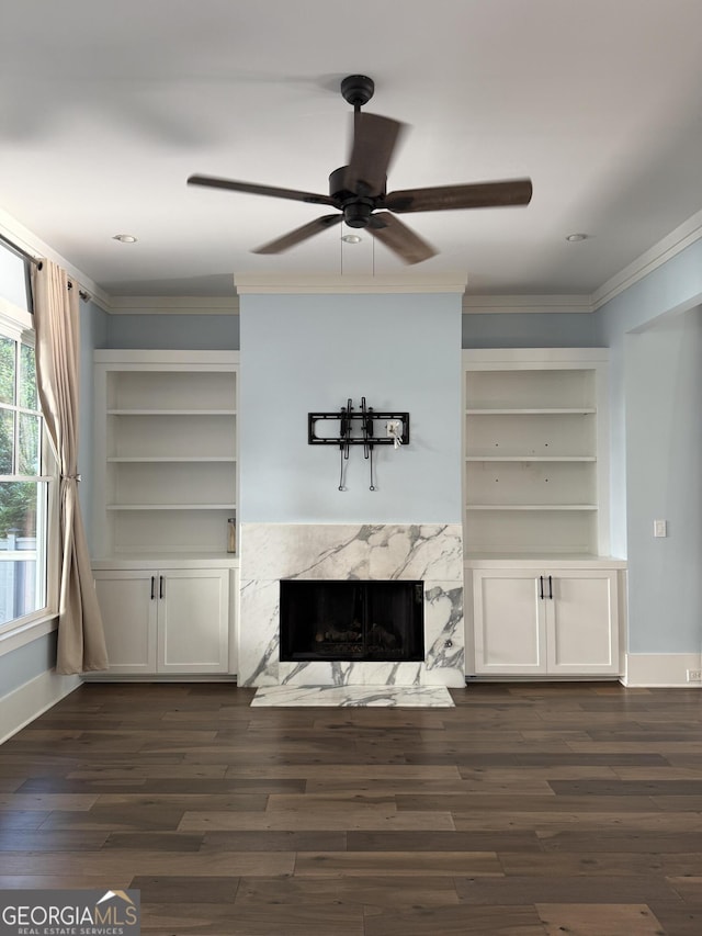 10583 Serenbe Ln, Palmetto, GA 30268 - unfurnished living room with a premium fireplace, dark wood finished floors, ornamental molding, and a ceiling fan