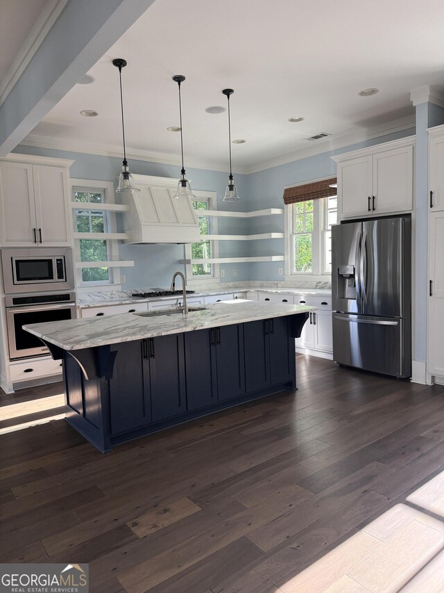 10583 Serenbe Ln, Palmetto, GA 30268 - kitchen featuring stainless steel appliances, open shelves, white cabinetry, custom range hood, and ornamental molding