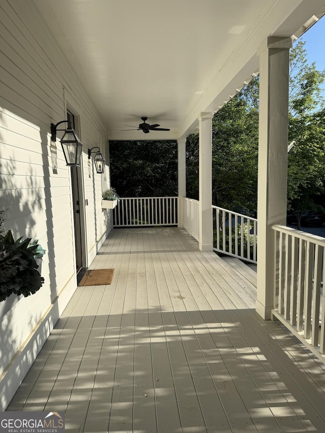 10583 Serenbe Ln, Palmetto, GA 30268 - wooden porch with a ceiling fan