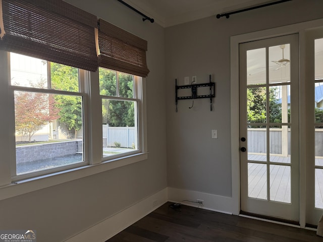 10583 Serenbe Ln, Palmetto, GA 30268 - doorway to outside featuring dark wood-type flooring and baseboards