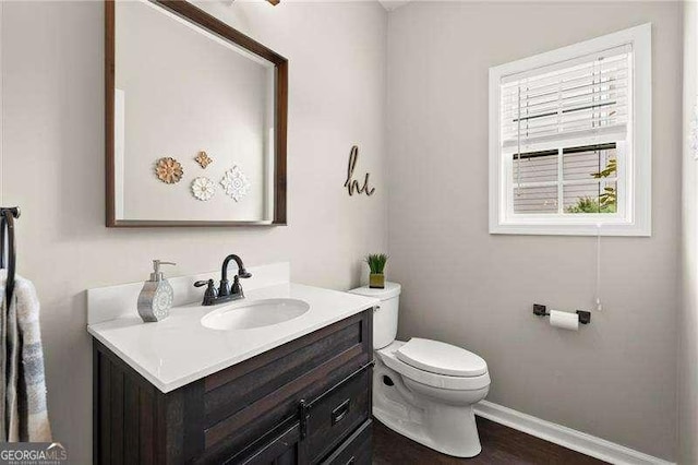 214 Crestmont Way, Canton, GA 30114 - half bath with baseboards, toilet, vanity, and wood finished floors