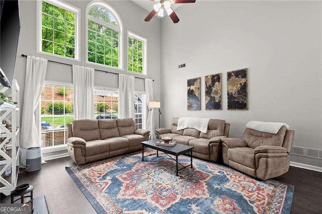 214 Crestmont Way, Canton, GA 30114 - living room with plenty of natural light, dark wood-style flooring, a ceiling fan, and a towering ceiling