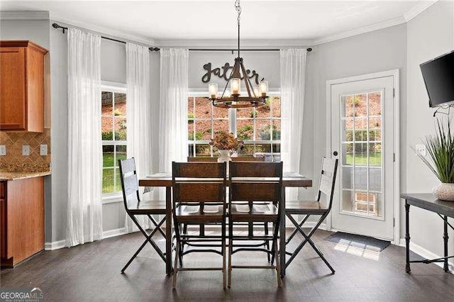 214 Crestmont Way, Canton, GA 30114 - dining room with a chandelier, plenty of natural light, crown molding, baseboards, and dark wood finished floors