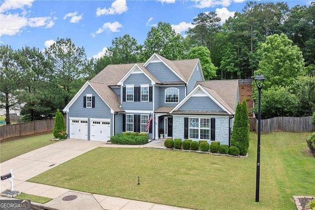 214 Crestmont Way, Canton, GA 30114 - view of front facade featuring driveway, an attached garage, and stone siding
