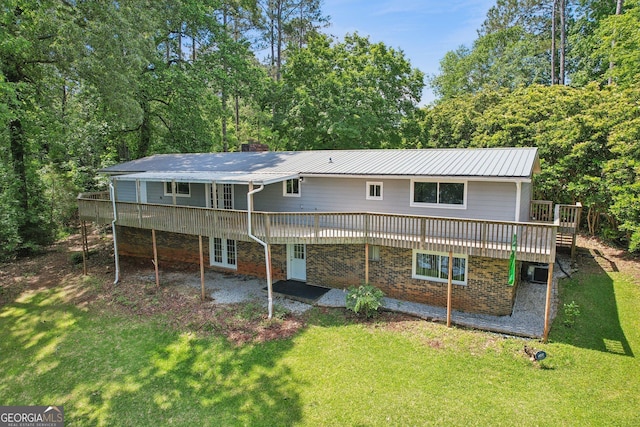 54 Owl Ct, Monticello, GA 31064 - rear view of house featuring a deck, a yard, a patio area, a chimney, and brick siding