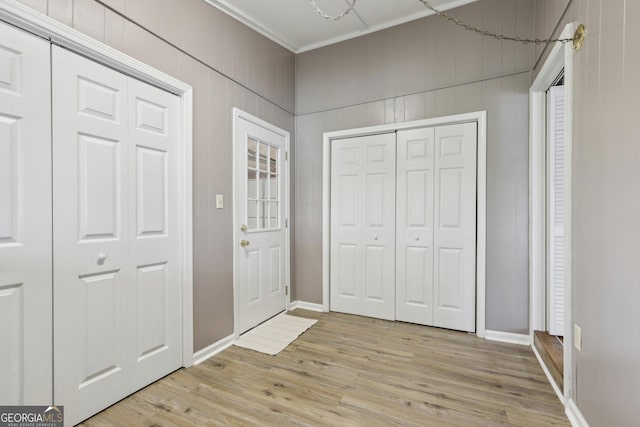 54 Owl Ct, Monticello, GA 31064 - foyer with light wood finished floors, baseboards, and ornamental molding