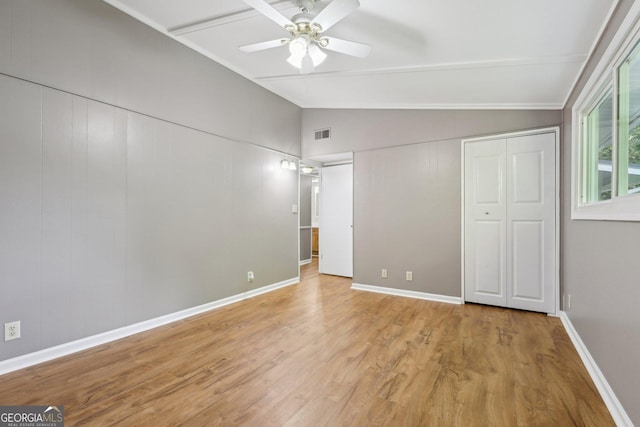 54 Owl Ct, Monticello, GA 31064 - unfurnished bedroom with vaulted ceiling, wood finished floors, a ceiling fan, and a closet