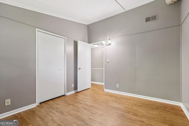 54 Owl Ct, Monticello, GA 31064 - unfurnished bedroom with wood finished floors, baseboards, and a closet