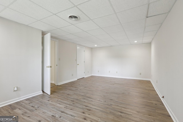 54 Owl Ct, Monticello, GA 31064 - unfurnished room featuring wood finished floors, baseboards, a paneled ceiling, and recessed lighting