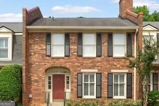 27 Jefferson Hill Pl NE, Atlanta, GA 30342 - view of front of property featuring brick siding and a chimney