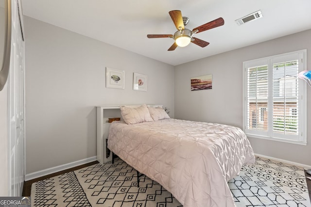 27 Jefferson Hill Pl NE, Atlanta, GA 30342 - bedroom featuring baseboards and ceiling fan