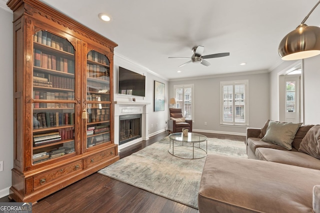 27 Jefferson Hill Pl NE, Atlanta, GA 30342 - living room featuring crown molding, a fireplace, recessed lighting, a ceiling fan, and dark wood-type flooring