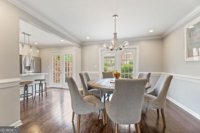 27 Jefferson Hill Pl NE, Atlanta, GA 30342 - dining space with a chandelier, healthy amount of natural light, dark wood-style flooring, recessed lighting, and ornamental molding