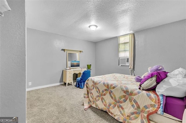 bedroom featuring carpet floors, a textured ceiling, a textured wall, cooling unit, and baseboards