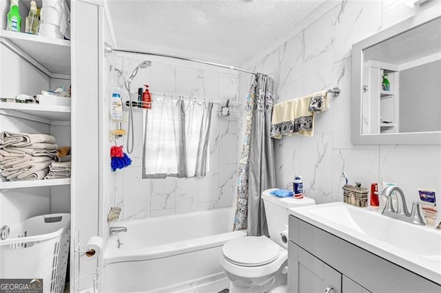 bathroom featuring a textured ceiling, shower / bath combination with curtain, toilet, and vanity