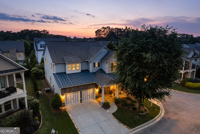 3000 Haven Mill Ln, Milton, GA 30004 - view of front of home with a standing seam roof, concrete driveway, stone siding, an attached garage, and a metal roof