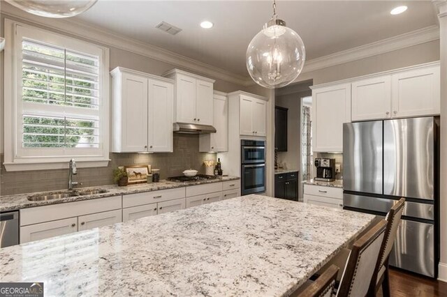 3000 Haven Mill Ln, Milton, GA 30004 - living area with a chandelier, wood finished floors, stairs, recessed lighting, and ornamental molding