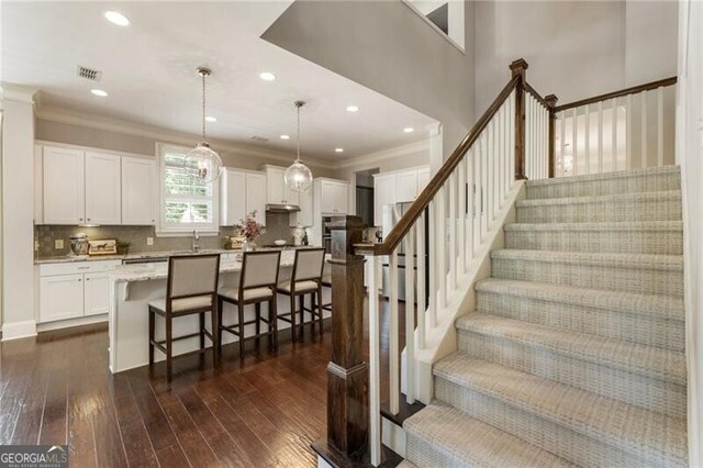 3000 Haven Mill Ln, Milton, GA 30004 - living room featuring dark wood-style flooring, a chandelier, ornamental molding, a desk, and recessed lighting