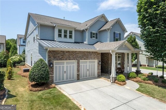 3000 Haven Mill Ln, Milton, GA 30004 - craftsman-style home featuring driveway, a standing seam roof, a front yard, and stone siding