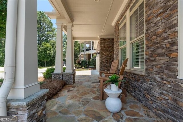 3000 Haven Mill Ln, Milton, GA 30004 - dining area with a chandelier, a fireplace, hardwood / wood-style floors, ornamental molding, and a decorative wall